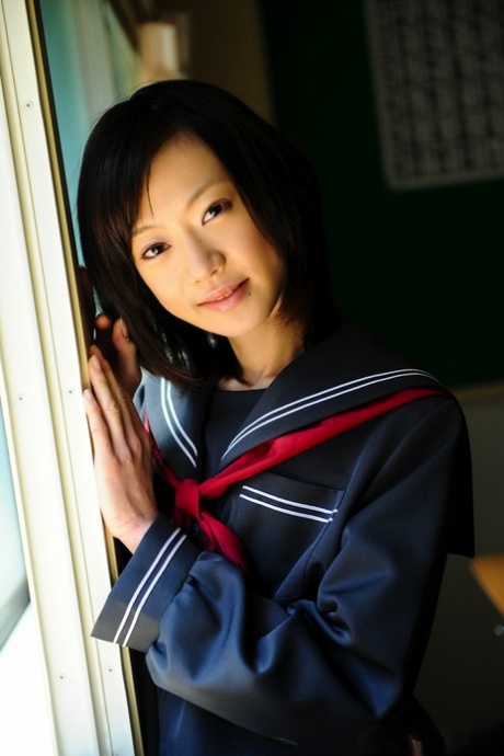 Barely Legal Japanese Student Shows Her Bare Knees In Her School Uniform