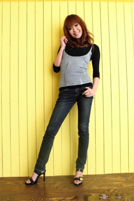 Japanese girl with long hair and hot pink lips poses in sexy bras alongside jeans, heels.