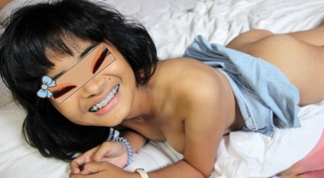 Etno, the petite Indonesian beauty, dabs from her pussy after having an affair with a white man.