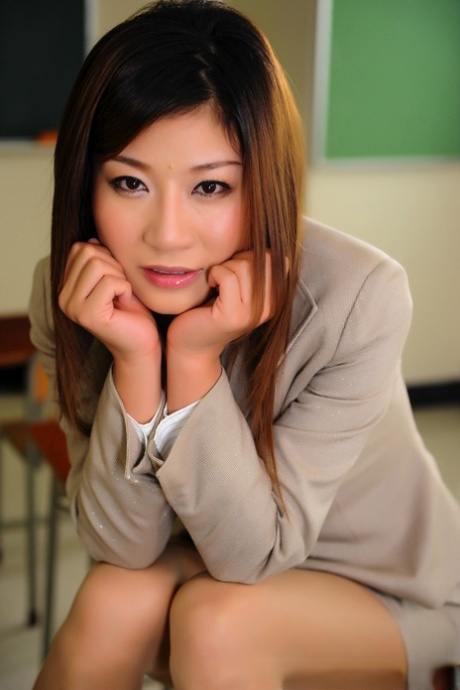 An American school teacher in Japan displays a few legs while wearing a short skirt.