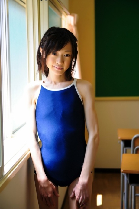 Tiny Japanese Girl Model Non Nude In A Swimsuit On School Desk