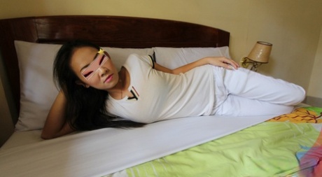 Horny Asian prostitute with tramp stamp sneezed by a white traveler.