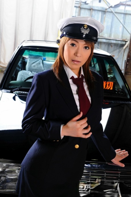 During an upskirt action, the female taxi driver in Japan exposes her blouse.