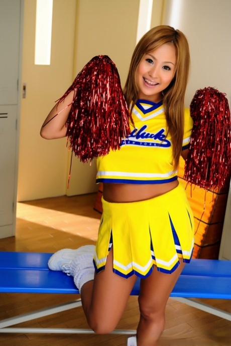 Beautiful Japanese cheerleader puts on great tits before she shows her pussy.