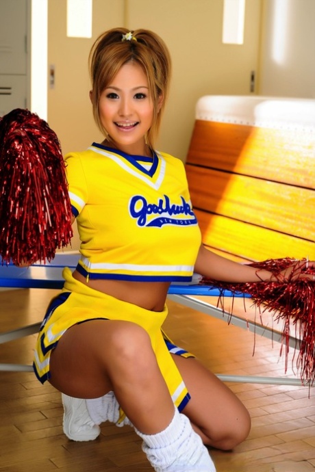 Great tits are revealed by the charming Japanese cheerleader before she displays her pussy.