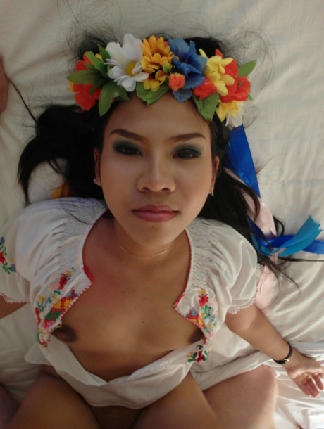 Asian chick Aziza replaces flowers on her head with cum on her pussy