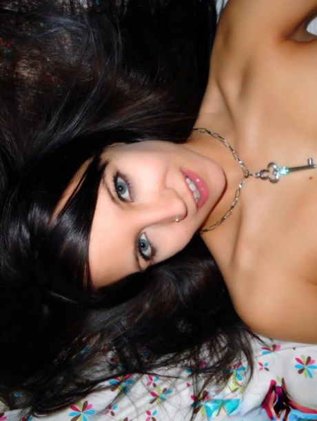 Skinny teen Andi Land takes self shots while pulling down her thong