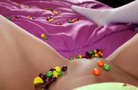 As she shows her tits, Andi Land young girl covers herself in candy and proceeds to steal from her.