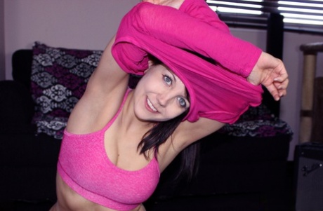 While practicing yoga, Andi Land showcases her acrobatic muscles and buttocks.