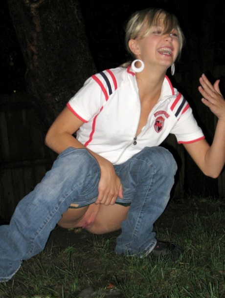 In the evening, Kasia, a blonde amateur, drinks in the backyard and pees.