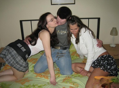 Women in college engage with a willing partner to participate in threesome sex.