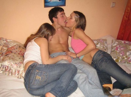 College Girls Have A Threesome With Their Fuck Buddy On Top Of A Bed