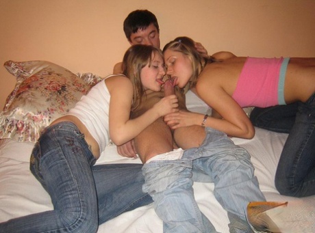 College Girls Have A Threesome With Their Fuck Buddy On Top Of A Bed
