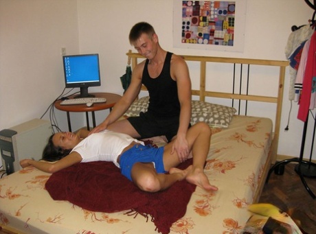 Prior to having sex on the bed, college students expose themselves completely naked.