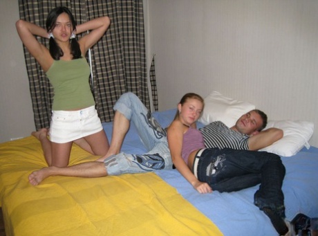 Young Girls Kiss Before Treating Their Man Friend To A Threesome