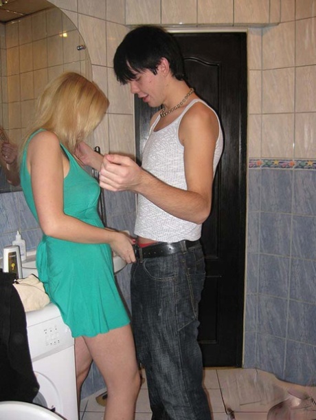 Young blonde and her boyfriend initiate their romantic relationship in the bathroom.