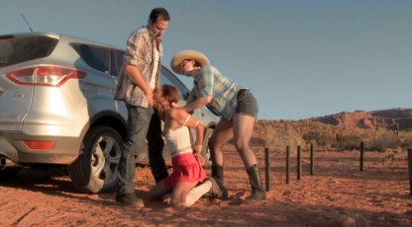 In the desert, a white hitchhiker is restrained and penetrated.