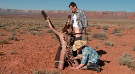 In the desert, a white hitchhiker is restrained and penetrated.