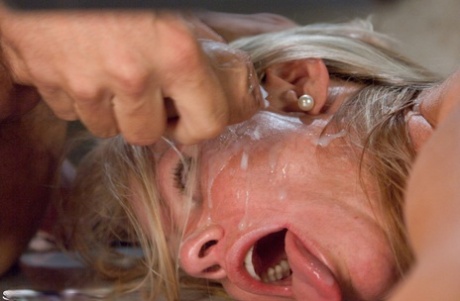 During her time in jail, Simone Sonay, a lawyer with blonde hair, is restrained and fouled by her client.