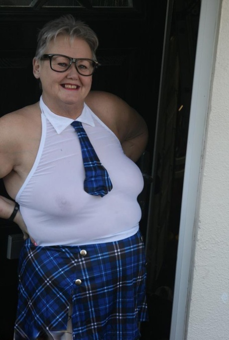 Wearing a fat granny disguise and scorching schoolgirl attire, Valgasmic Exposed poses outside in her piss.