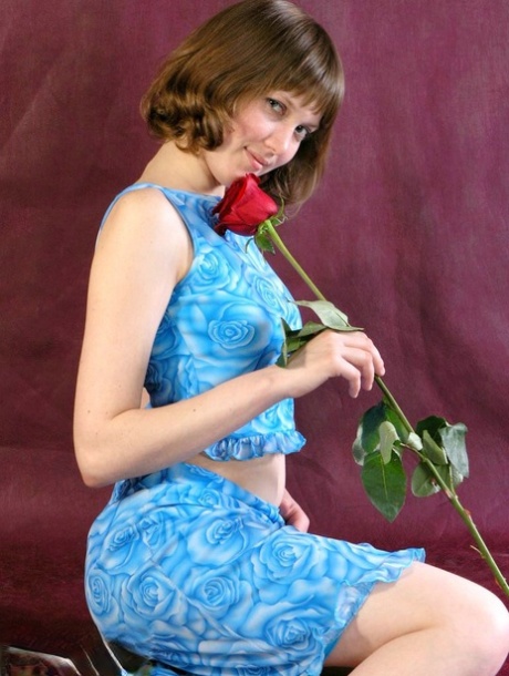 Adorable Teen Anabell Sniffs A Red Rose Before Taking Off Her Clothes