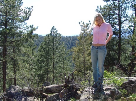 A POV on a forested hill is where Naughty Allie, the hot blonde, gives an impressive blowjob while dressed up.