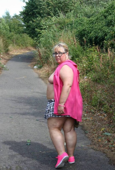 Outdoor walking: Lexie Cummings, left, an amateur BBW, wears the buttocks on her right as she takes a breather while wearing only a raccoon tail.