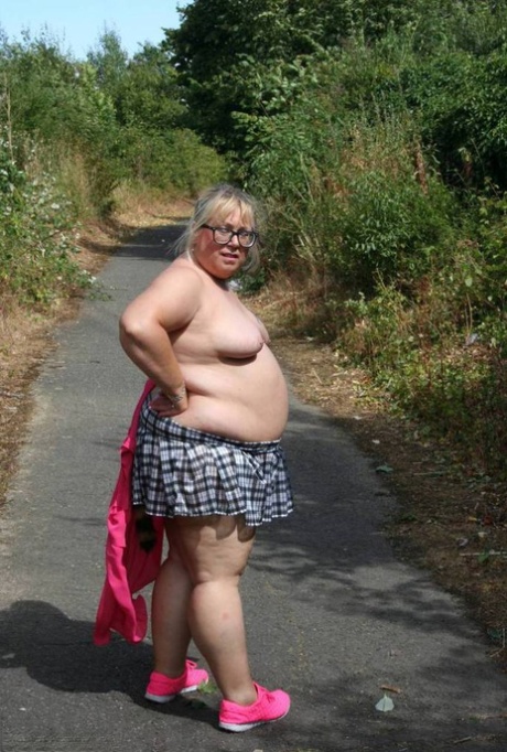 In an outdoor stroll, Lexie Cummings, a beginner member of the BWW, wears a small plastic bag with a raccoon's tail.