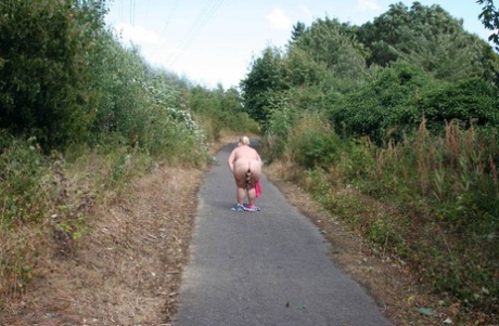 Extends: During an outdoor stroll, Lexie Cummings (left), an amateur BBW who is 25 years old wears the back of herring with its tail tied shut to make it easier for others to