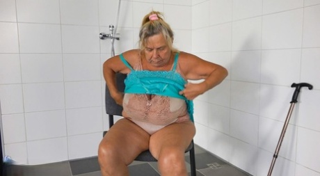 Obese Blonde Granny Hedwig Masturbates On A Chair In A Shower