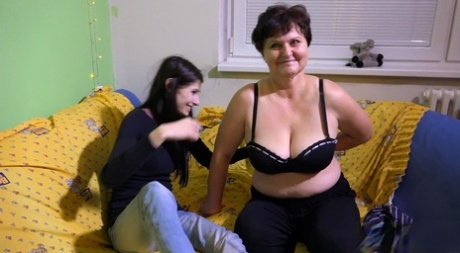 In sex, Brigita the older woman with a young brunette engages in sexual activity with her.