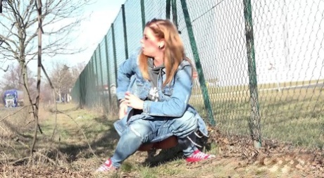 White Girl Chrissy Takes A Badly Needed Piss Next To A Chain-link Fence