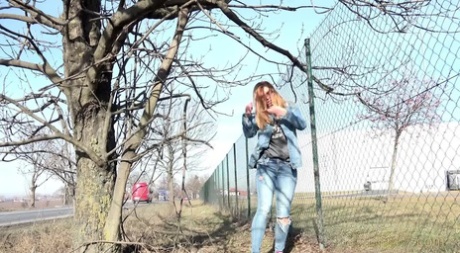 White Girl Chrissy Takes A Badly Needed Piss Next To A Chain-link Fence