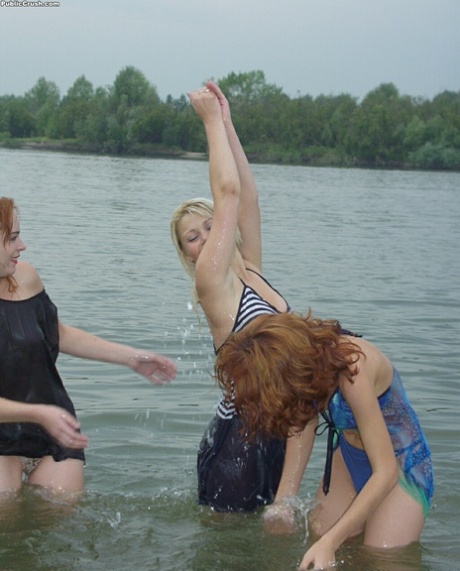 Teen girls partially remove wet clothing after wading into a river - PornHugo.net