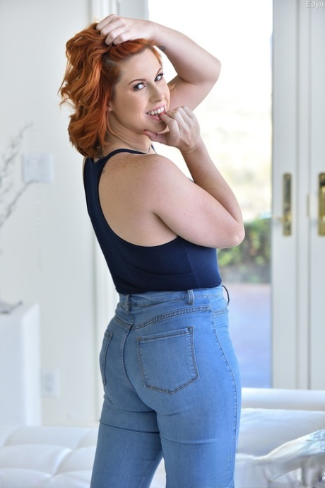 A blue jeans are worn by a redhead model as she heads to the butthole and vagina.