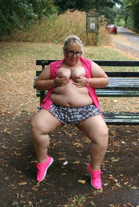 Obese British athlete Lexie Cummings bares herself on a public picnic table.