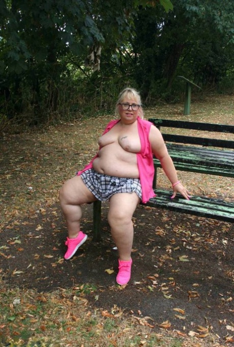 The naked Lexie Cummings, an obese British amateur athlete from the United Kingdom, exposes herself on a public picnic table.