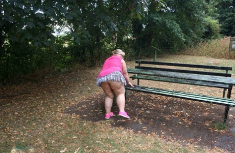 Lexie Cummings, a British amateur who is elderly and in good physical shape, exposes herself on a public picnic table.