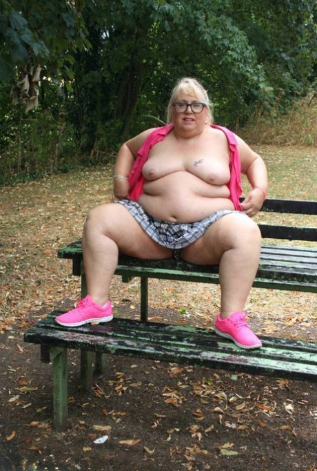 An elderly British athlete named Lexie Cummings bares herself on a public picnic table.