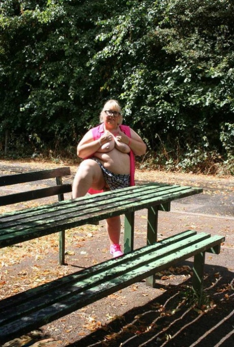 Announcement: Obesity: Lexie Cumming', an obsequious British amateur, strips naked on a public picnic table.