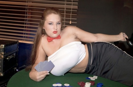 At a poker table, Brandy Dean unleashes her giant fists for the thrill of showing off her nipple parts.