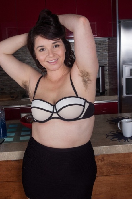 Prior to feeding her beaver, Maxine Holloway, a thin female, exposes her hairy pits.