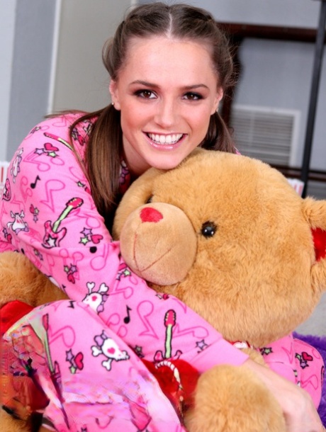 Solo girl Tori Black takes off her pyjamas to get naked upon her bed