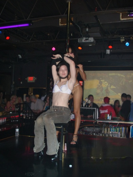 Katsuni, an Asian stripper, is pictured in candid fashion at an adult club.