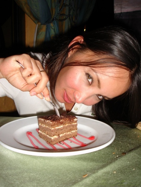 Katsuni, an amateur from Asia who is dressed in a topless vest, poses for several candid snaps.