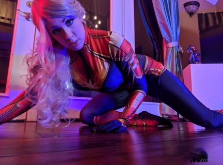 Blonde amateur: Kayla Kiss removes her superheroine outfit.