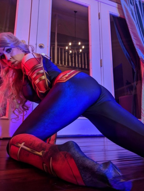 As a blonde amateur, Kayla Kiss removes her superheroine attire.