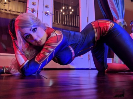 Excessive bra and thong: Blonde amateur Kayla Kiss strips off in her superheroine outfit.