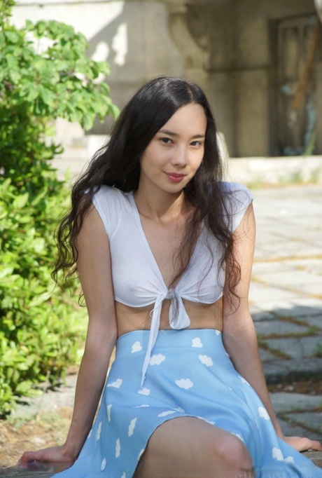 Asian Teen Djessy Sports A No Panty Upskirt Before Posing Naked On A Patio