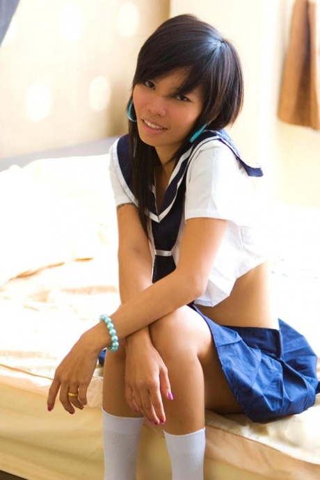 Due to a BJ and facial cumshot, Asian girl Puy removes her navy blue suit after disrobing of the sailor uniform.